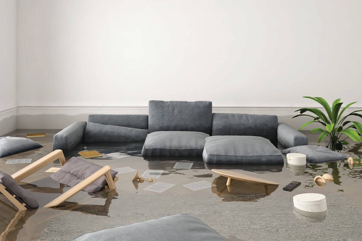 flooded living room with couch and chairs2