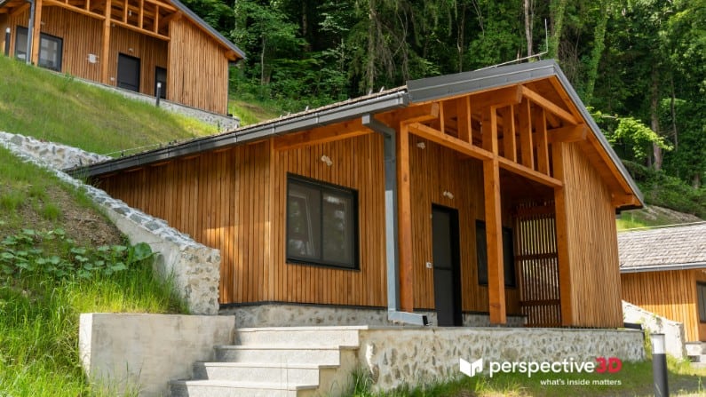 High-quality 3D virtual tour of a cozy wooden cabin nestled in lush forest surroundings.