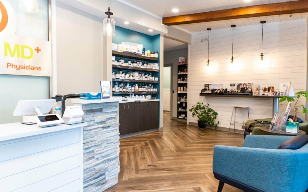 Modern medical clinic interior with reception desk and seating area.