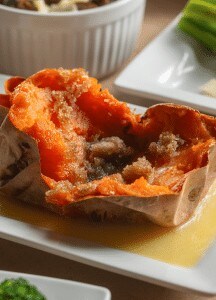 Sizzling stuffed poblano pepper with cheese and sauce.