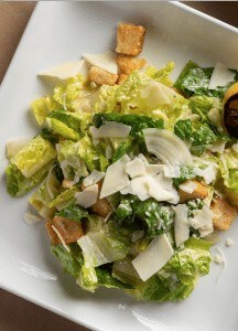Fresh Caesar salad with crispy croutons and Parmesan cheese. Perfect side dish at Prime Steakhouse.