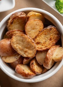 Golden roasted potato halves served at Prime Steakhouse.