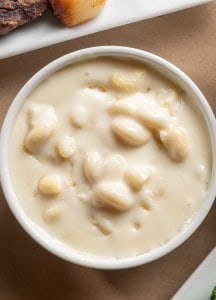 Creamy potato soup with chunks of potatoes and a smooth, rich texture.