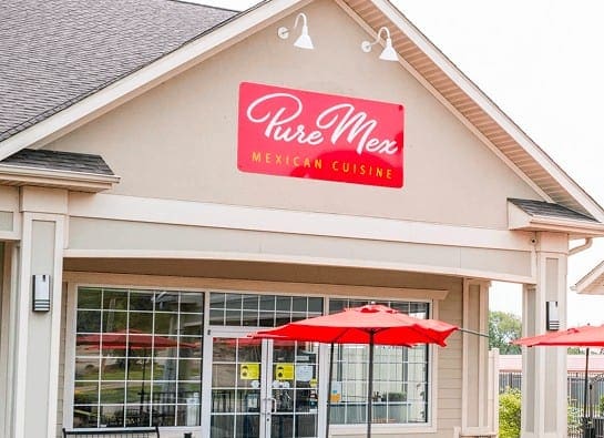 Exterior of Pure Mex Richland restaurant with red awnings—authentic Mexican cuisine in a warm, welcoming West Michigan setting.