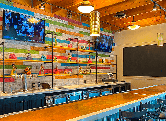 Modern interior of Pure Mex Byron Center featuring colorful decor and seating—vibrant Mexican restaurant atmosphere in West Michigan.