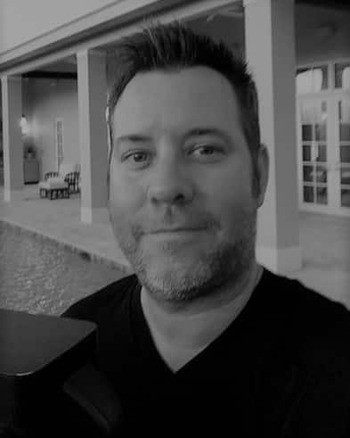 Portrait of John R. at Reality Capture Experts in black and white.