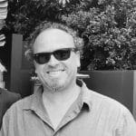Man with sunglasses smiling outdoors at Reality Capture Experts.