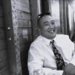 Smiling man in white shirt and tie at Reality Capture Experts.