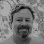 Portrait of Chris J. from Reality Capture Experts in black and white.