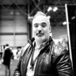 Portrait of Daniel M. at a technology event, black and white photo.