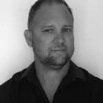 Portrait of Dean S., a reality capture specialist, in black and white.