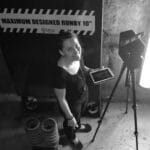Woman operating 3D scanning equipment for reality capture.