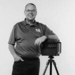 Jon J. standing with 3D laser scanner for reality capture.