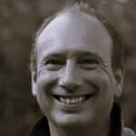 Portrait of Kees S. smiling, professional headshot.