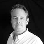 Portrait of Kevin B. from Reality Capture Experts in black and white.