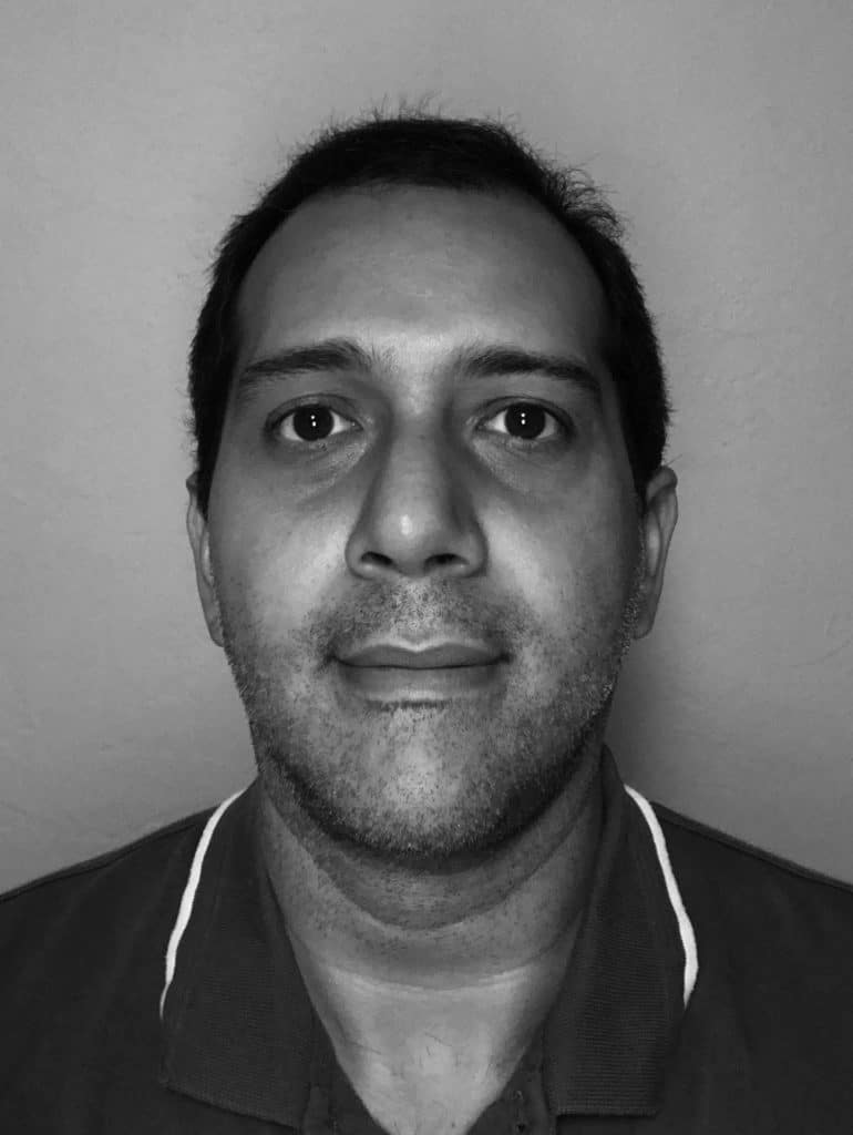 Black and white portrait of Sebastian A. facing camera.