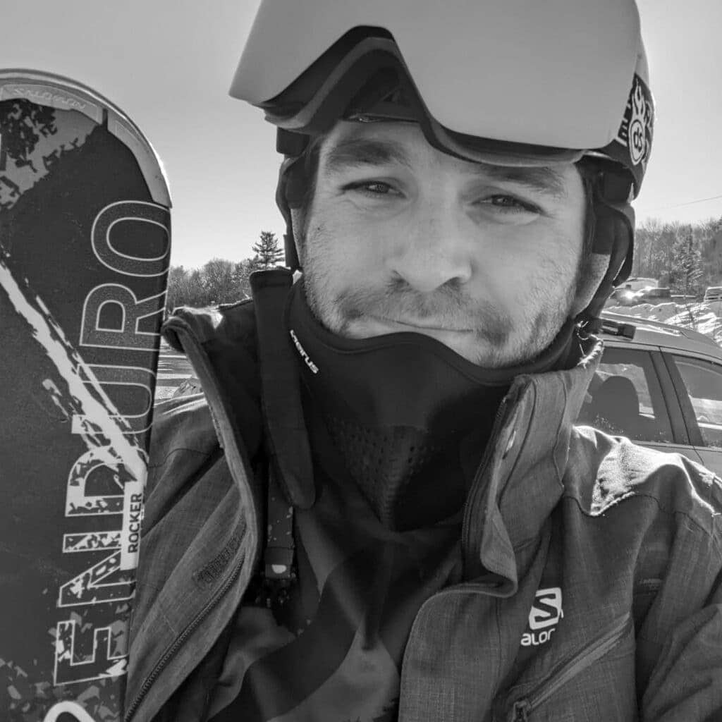 Skier wearing helmet, goggles, and winter gear outdoors.