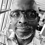 Close-up of Joseph G. wearing glasses at Reality Capture Experts.