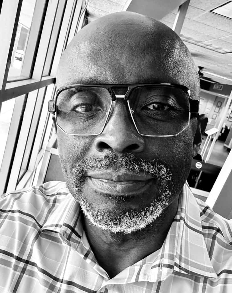 Close-up of Joseph G. wearing glasses at Reality Capture Experts.