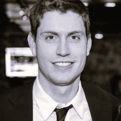 Portrait of Alexis W. in a professional setting, smiling.