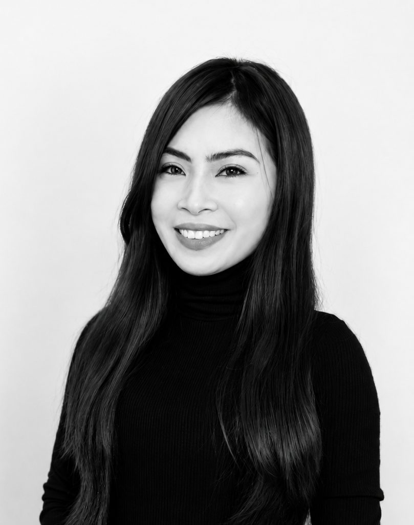 Portrait of Reshiel B. smiling, black and white photo.