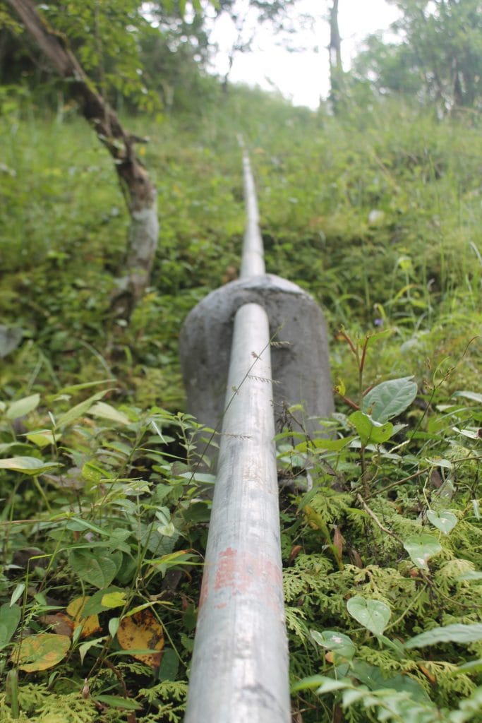 Large steel water pipe travelling uphill 