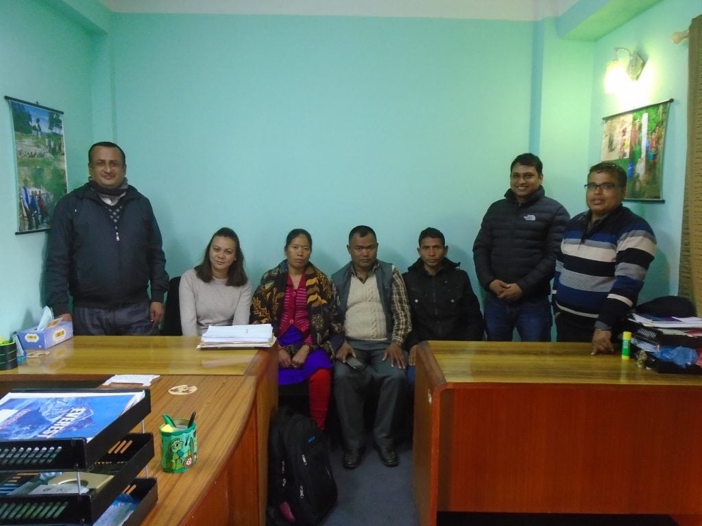 Renewable World project staff and community members from Jugedhara at the technical contractor's office 