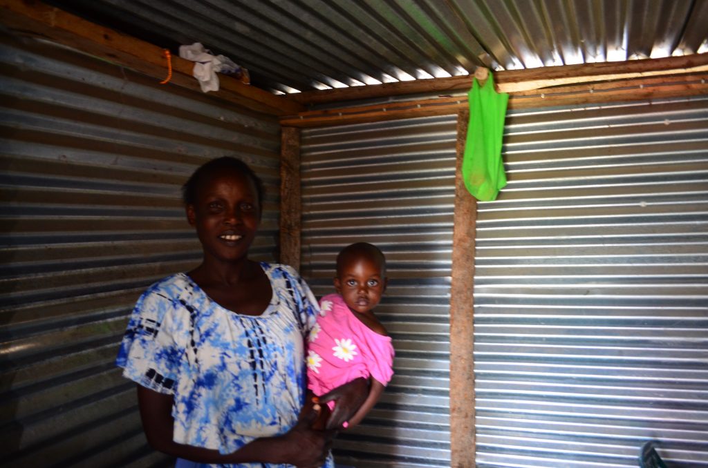 Lillian standing inside her shop