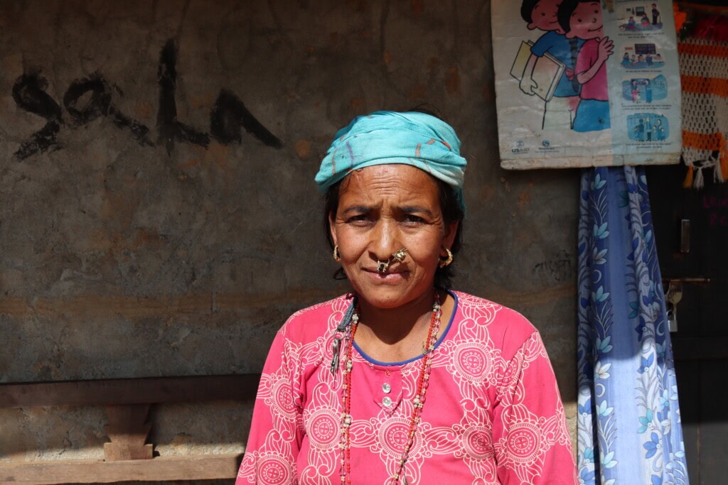 A close-up photo of Hima Rana standing outside a health post