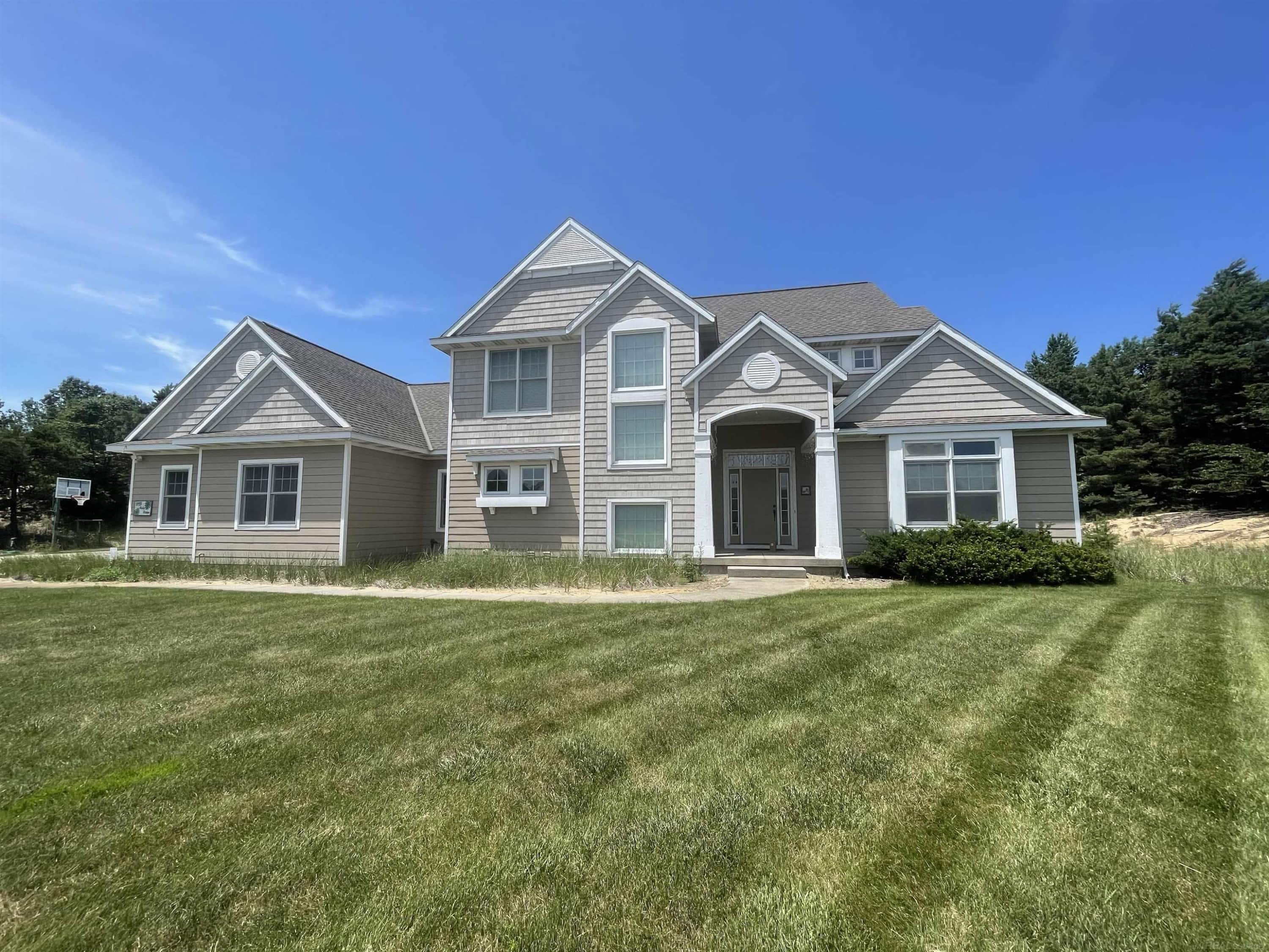 Located in Holland, this 4-bed, 3.5-bath turnkey home sits on 2.78 acres. Spanning 4200sq ft, it features updated quartz countertops in the kitchen and primary bath, a modernized upstairs bath, and a cozy television room/den. The fully finished basement includes a dedicated media and theater room, while the expansive grounds feature an impressive pool barn. A newer HVAC system ensures year-round comfort.