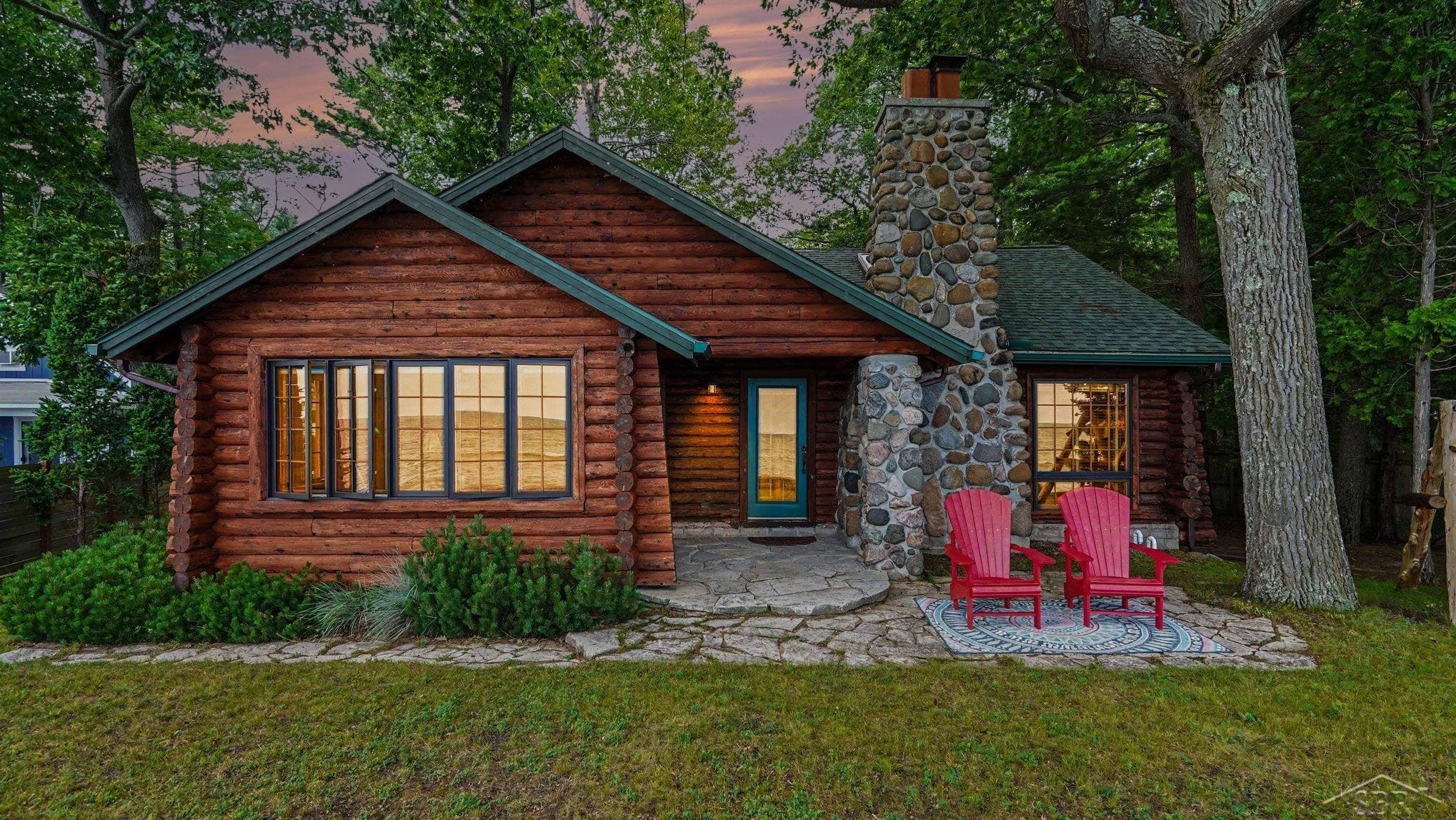 Experience the timeless beauty of this extraordinary Lake Huron log home, where handcrafted craftsmanship and breathtaking waterfront views create an unforgettable retreat. From the moment you arrive, you will appreciate the warmth and authenticity of rich log construction, soaring wood-beamed ceilings, and an impressive natural stone fireplace that anchors the inviting living space. Expansive lakeside windows fill the home with natural light while showcasing panoramic views of Lake Huron’s sparkling shoreline. This exceptional home features 3 bedrooms, 1 full bath, and a full basement offering abundant storage. Every room reflects the character and charm of a true log home, blending rustic elegance with modern comfort. Whether you are enjoying peaceful mornings watching the sunrise over the lake, entertaining family and friends, or unwinding beside the crackling fireplace, this home offers an unmatched lifestyle.