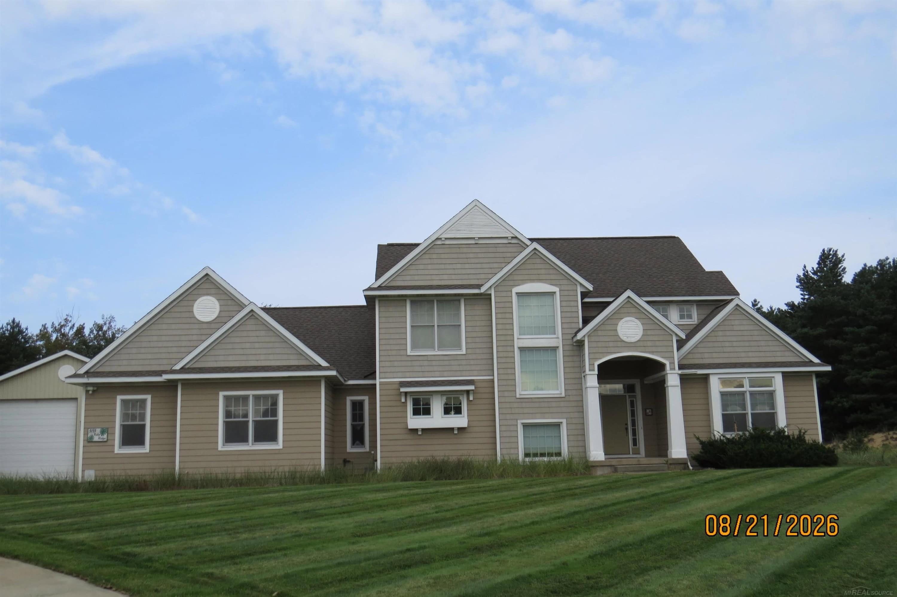 Taking Backup Offers - Located in Holland, this 4-bed, 3.5-bath turnkey home sits on 2.78 acres. Spanning 4200sq ft, it features updated quartz countertops in the kitchen and primary bath, a modernized upstairs bath, and a cozy television room/den. The fully finished basement includes a dedicated media and theater room, while the expansive grounds feature an impressive pool barn. A newer HVAC system ensures year-round comfort.