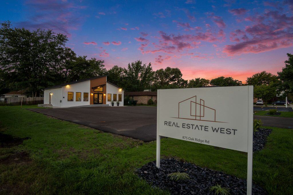 Modern real estate office building in West Michigan during sunset.