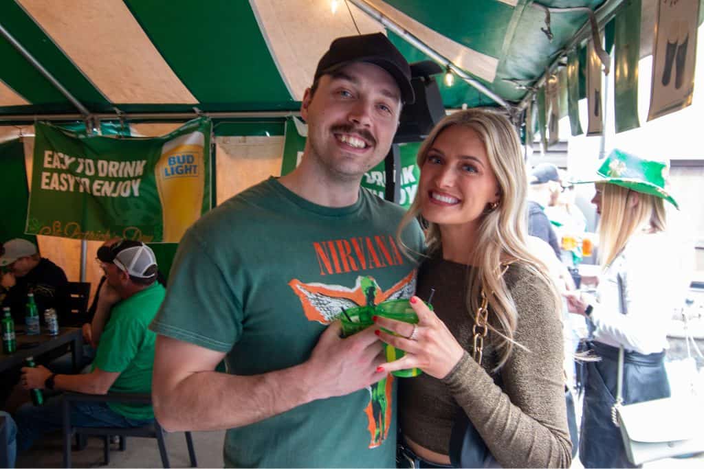 Happy couple enjoying drinks at Shamrock on Stocking event.