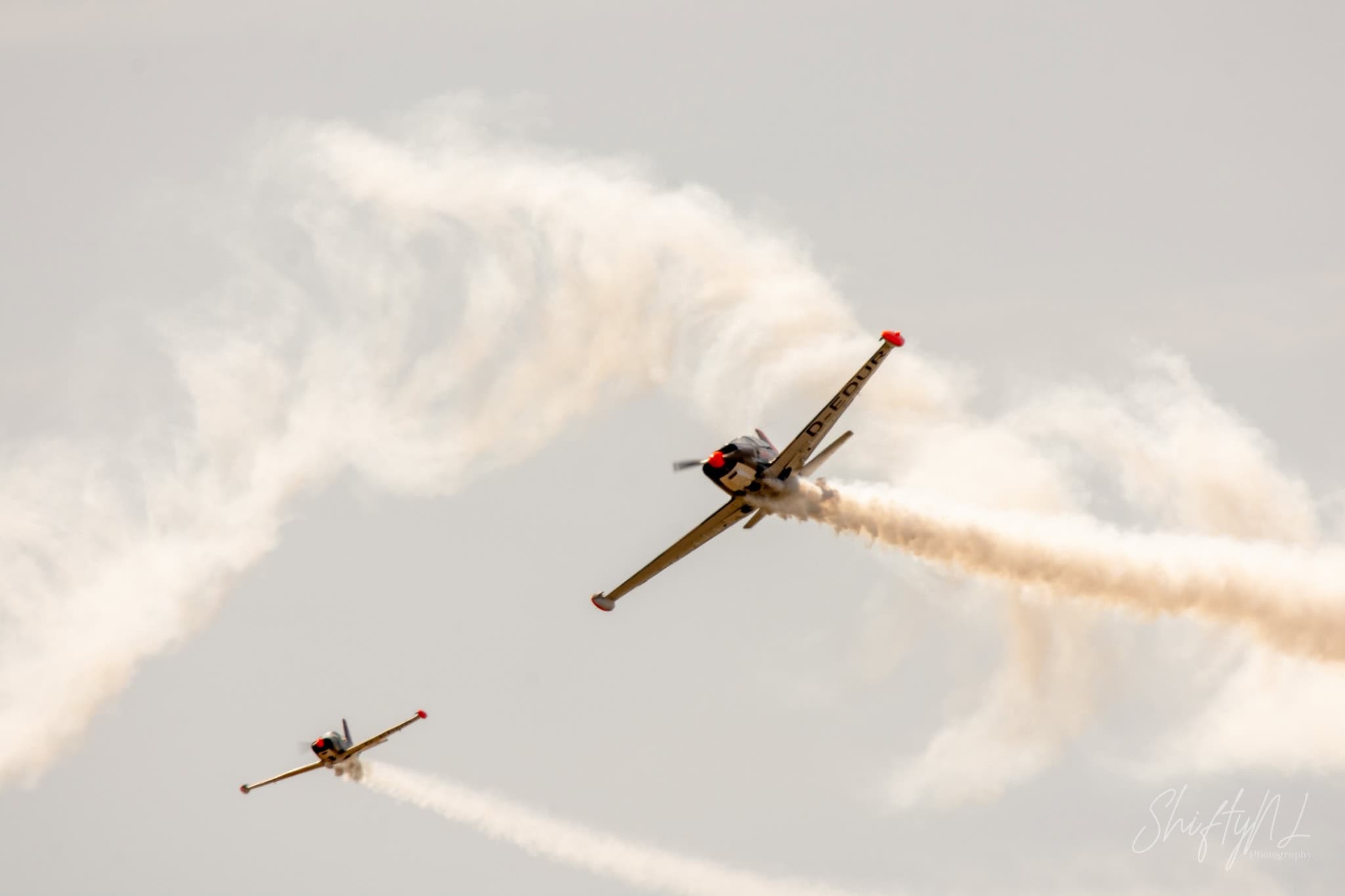 SF-260 Duo D-EDUR SIAI-Marchetti SF.260 D-EDUR flying in formation with an exact radio-controlled scale replica flown by the pilot's son at the Leaseweb Texel Airshow, Texel International Airport, the Netherlands, August 2018.