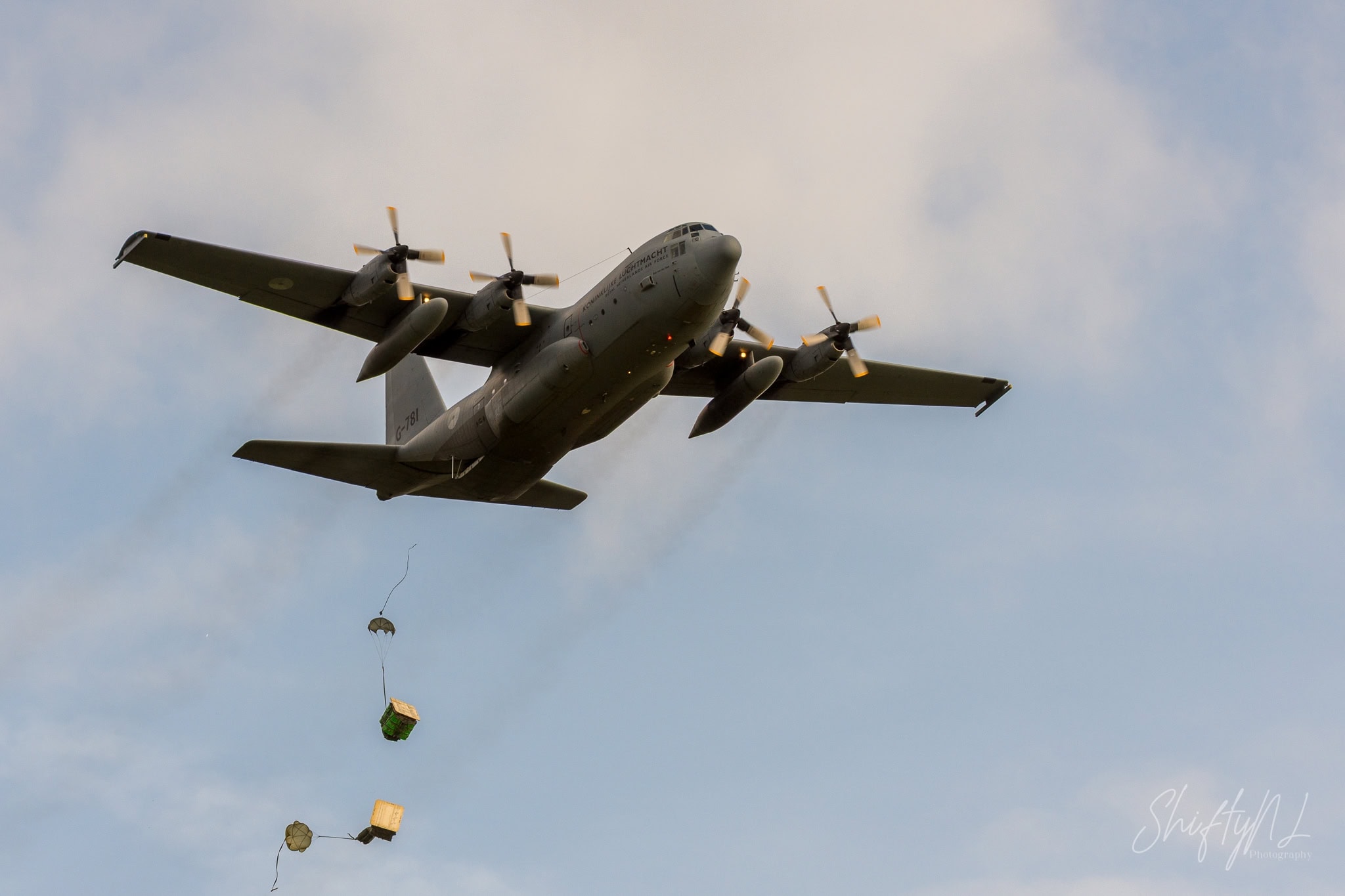 C-130 Hercules dropping cargo pallets on parachutes above Deelen Air Base, during exercise Falcon Autumn, the Netherlands, October 2018.