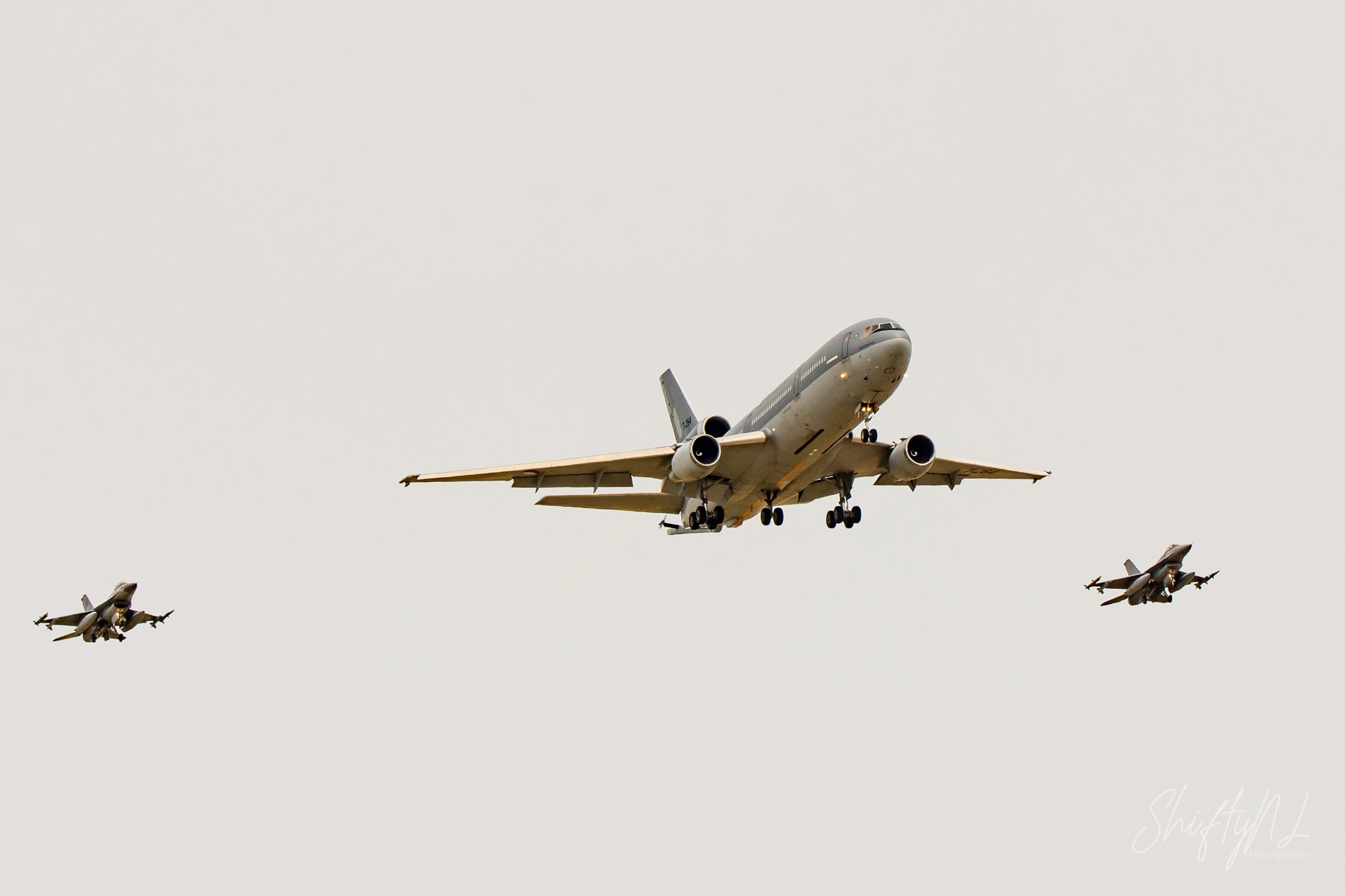 KDC-10 with F-16 Escort Royal Netherlands Air Force KDC-10 tanker T-264 flanked by two F-16 fighters at the Leaseweb Texel Airshow, Texel International Airport, the Netherlands, August 2018.