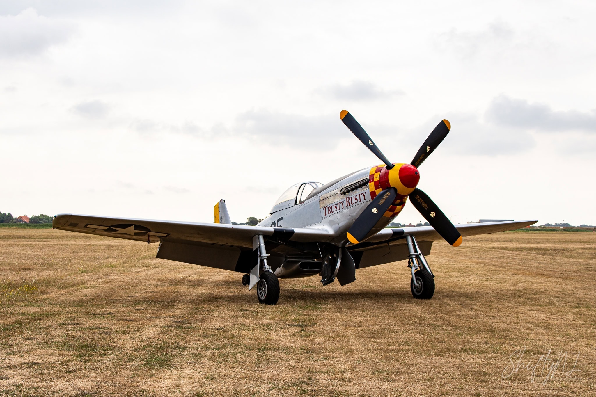 P-51 Mustang Trusty Rusty North American P-51D Mustang Trusty Rusty parked on the grass at the Leaseweb Texel Airshow, Texel International Airport, the Netherlands, August 2018.