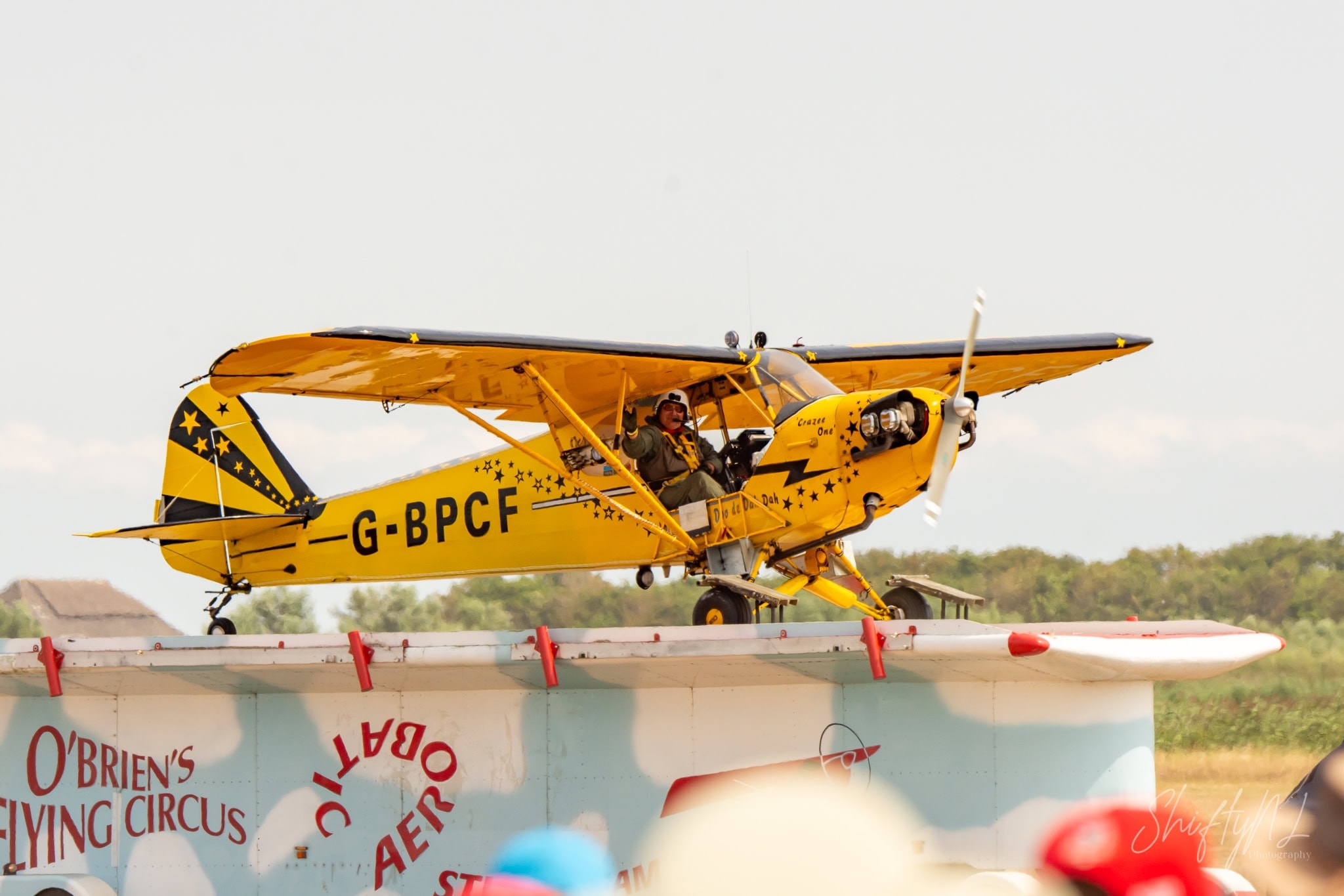 Piper Cub Truck Top Landing Piper Cub G-BPCF of O'Brien's Flying Circus after landing on top of a moving truck, pilot waving at the Leaseweb Texel Airshow, Texel International Airport, the Netherlands, August 2018.