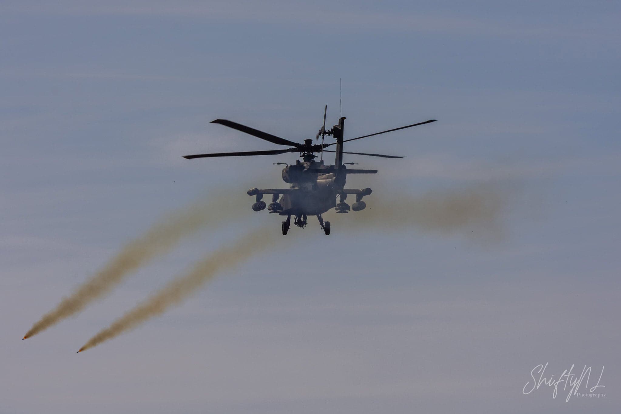 AH-64D Apache of 301 Squadron "Redskins", Royal Netherlands Air Force, hovering head-on low over the range at the Bergen (Osterheide) shooting range, Germany, March 2017.