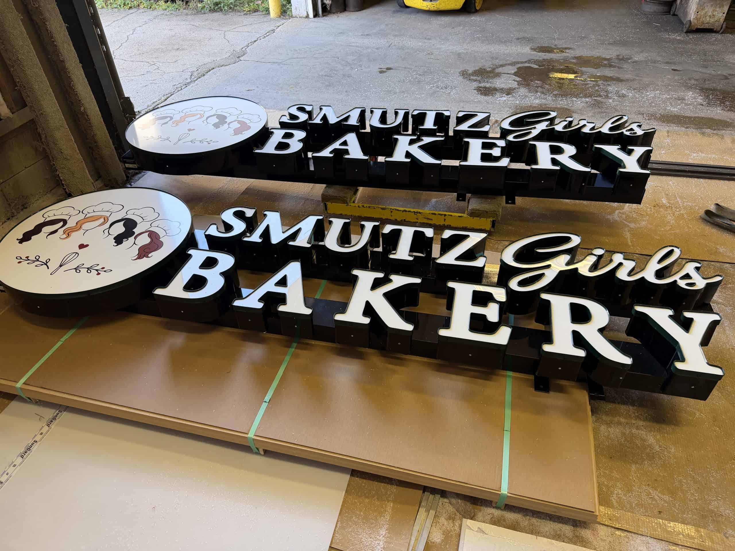 Custom 3D bakery sign for Smutz Girls Bakery with logo and lettering.