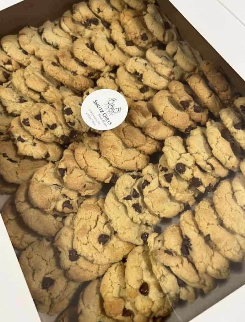 Freshly baked chocolate chip cookies from Smutz Girls Bakery in a box.