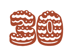 Number 30 cookie decorated with white icing and sprinkles for bakery celebration.