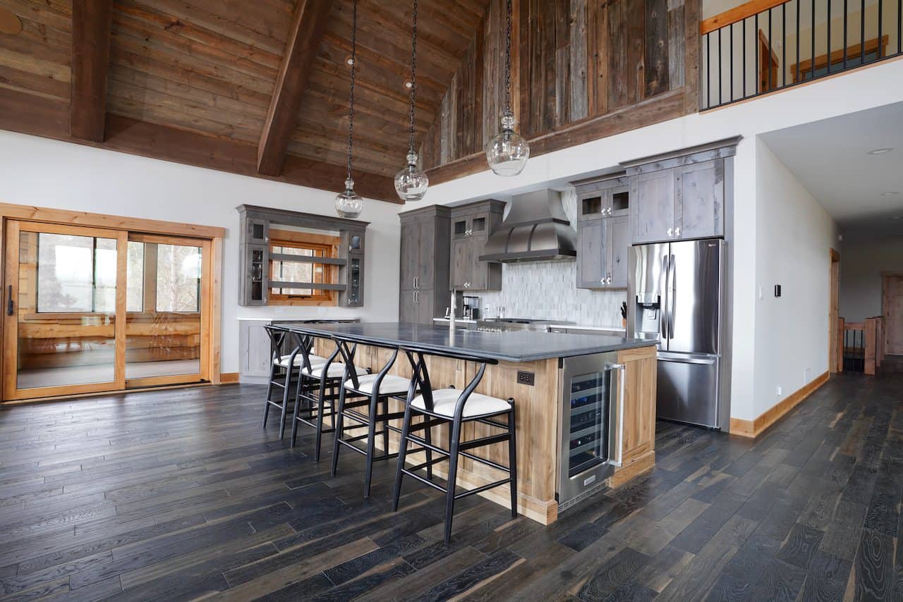 Contemporary kitchen with wooden cabinets, island, and stainless steel appliances.
