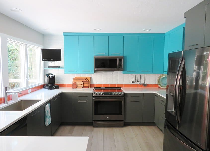 Contemporary kitchen with blue upper cabinets and gray lower cabinets.