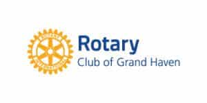 Rotary Club of Grand Haven logo with gear and text.