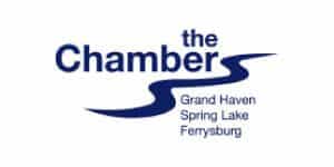 The Chamber logo with blue text and wave design for Grand Haven Spring Lake Ferysburg.