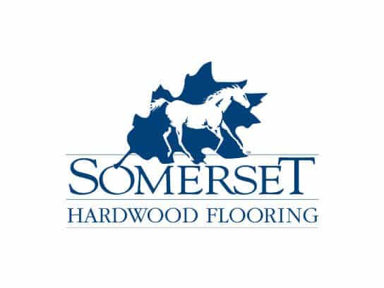 Somerset Hardwood Flooring logo with dog silhouette and wood background.