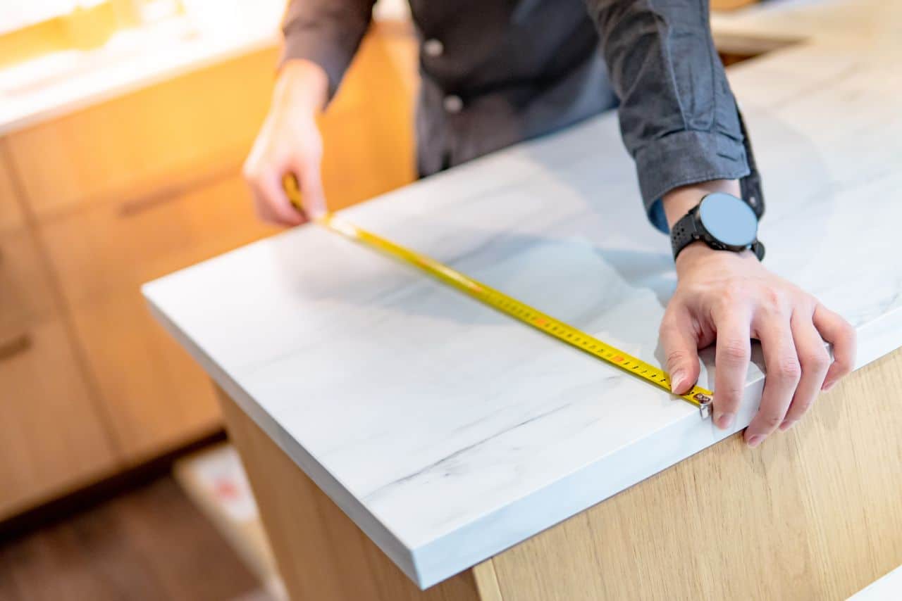 designer measuring countertop
