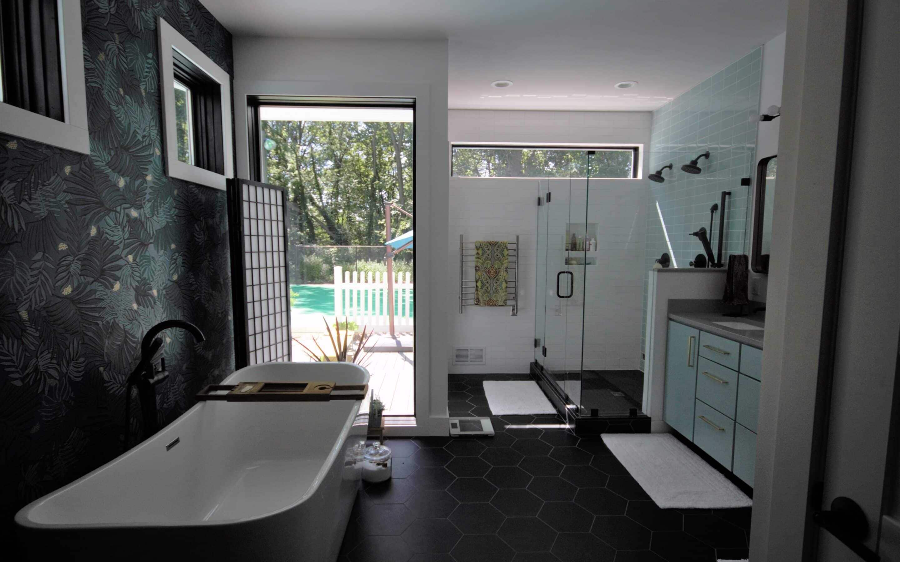 Contemporary bathroom with walk-in shower, bathtub, and stylish decor.